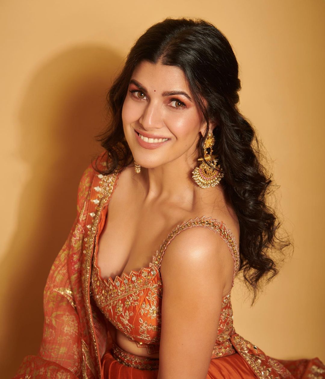 Bollywood Actress Nimrat Kaur Stills In Orange Lehenga Choli